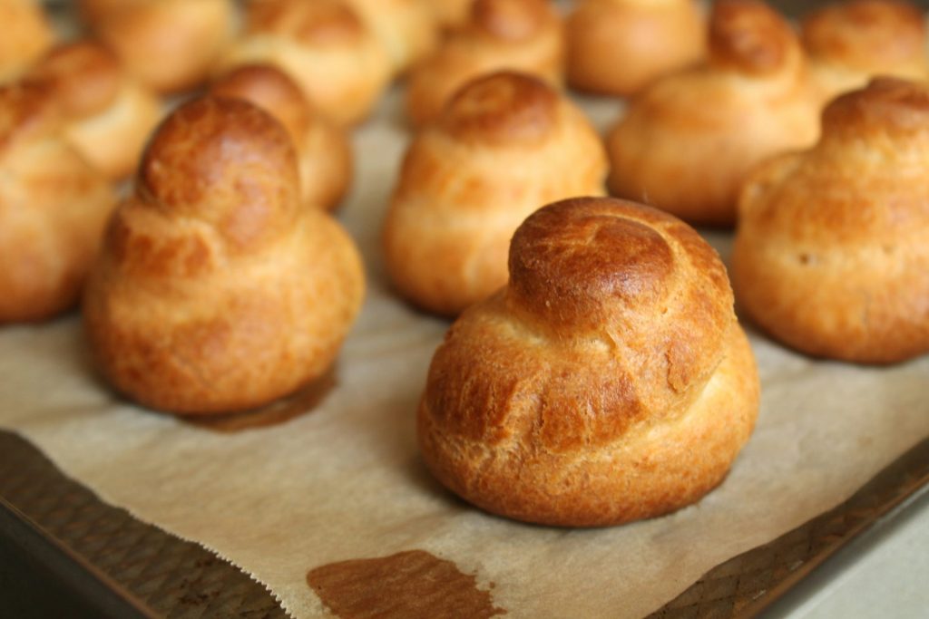 a close up of a tray of bread rolls