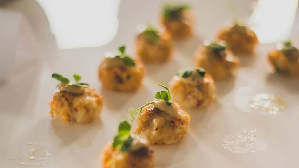small appetizers are arranged on a white plate