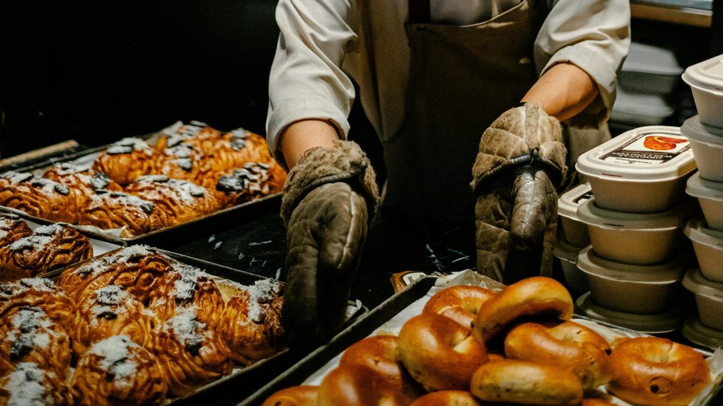 a man in a chef's hat is making doughnuts