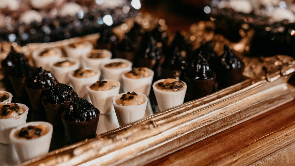 white candles on brown wooden tray