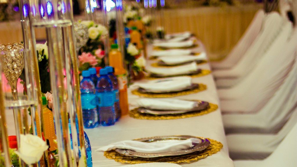 A long table is set with gold sequins